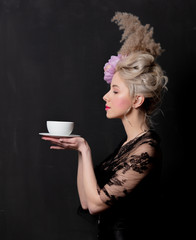 Beautiful blonde countess with a cup of tea