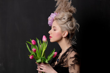 Beautiful blonde countess with tulips