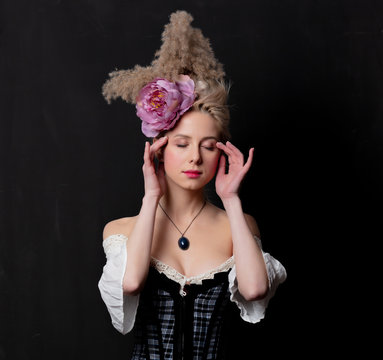 Beautiful blonde countess on dark
