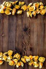 physalis on wooden background top view mock up