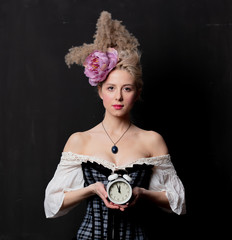 Beautiful blonde countess with alarm clock