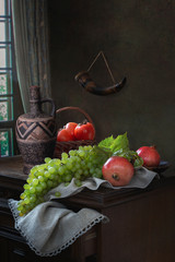 Still life with grapes bunch on a table