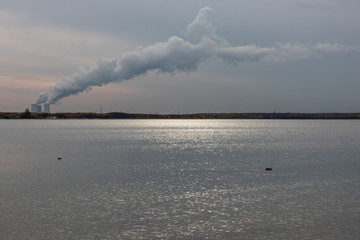 View from the lake Cospudener See a former brown coal opencast mine with coal power plant...