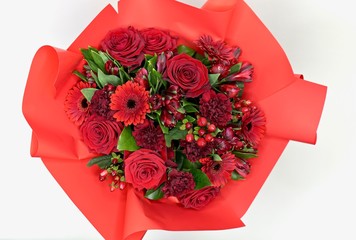 Beautiful valentiens day red floral arrangement. Red roses, and manycolorful flowers.