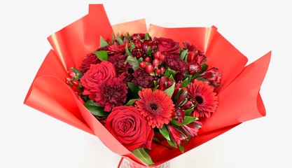 Beautiful valentiens day red floral arrangement. Red roses, and manycolorful flowers.