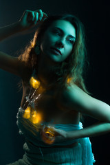 High Fashion model woman in colorful bright lights posing, portrait of a beautiful girl. Artistic colorful design. Party concept