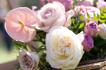 Bouquets of fresh flowers decoration of the festive table. Celebrating an open air party. Decor Details