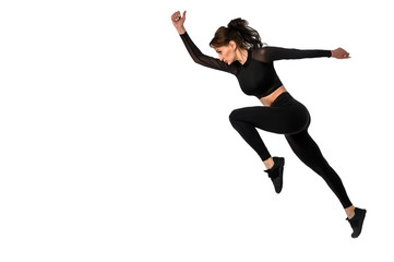 Fototapeta na wymiar Sporty woman runner in silhouette on white background. Photo of attractive woman in fashionable sportswear. Dynamic movement. Side view. Sport and healthy lifestyle