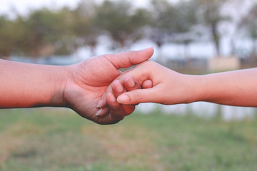 man and woman holding hands