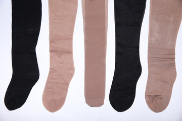 different new pantyhose on white background