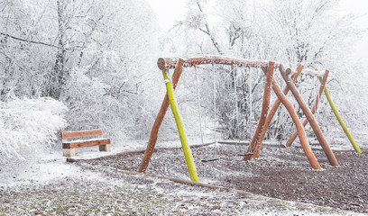 Playground in the park in winter