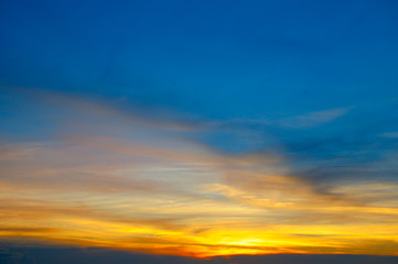 Fototapeta premium Cloudy sky and bright sunrise over the horizon.