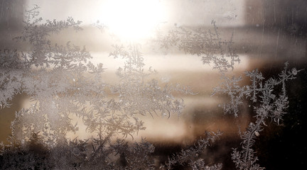 Frosty natural pattern on winter window, ornamental frost on the glass.