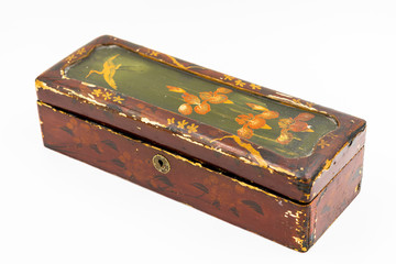 An old Chinese box with a painting of stork and lotuses. White background. Isolated .