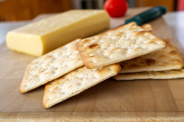 Crackers with cheese in the background