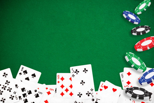 Gambling - Poker playing cards and chips green background