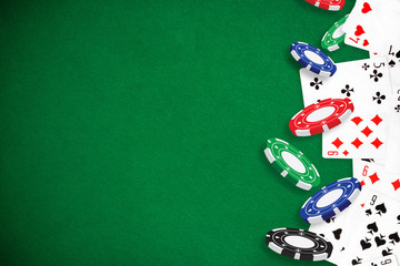 Gambling - Poker playing cards and chips green background