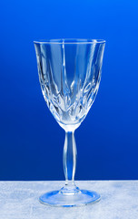 Crystal glass with close-up on a blue background