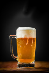 mug full of chopp, with chopp pilsen on a rustic table