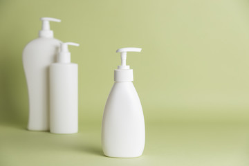White plastic soap dispensers. Copy space. Place for text.