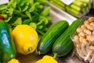 Lemon and cucumbers prepared on a silver plate