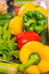 Well presented colorful mix of fresh yellow, red and green paprika