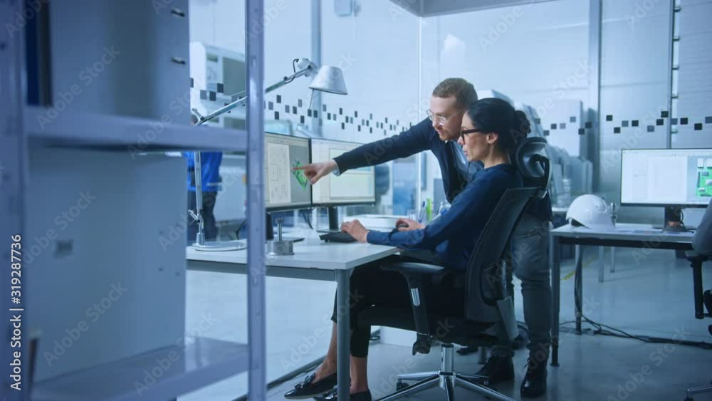 Poster modern electronics factory: male supervisor talks to a female electrical engineer who works on compu