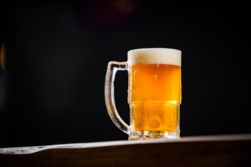 mug full of chopp, with chopp pilsen on a rustic table