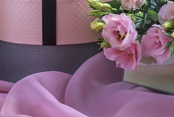 Elegant holiday card ideas. Flowers and boxes with ribbons on pink silk