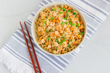 Chinese Shrimp Fried Rice, Popular Chinese Take Out Food, in a Bowl with Chopsticks, Top View Photo