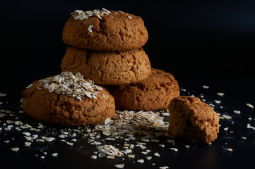 oatmeal cookies on a black background close-up