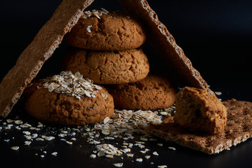 oatmeal cookies on a black background close-up