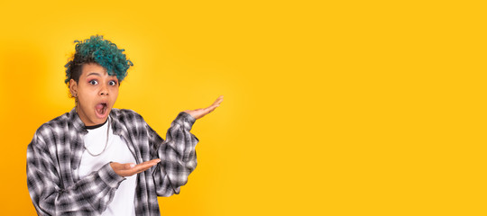 isolated girl pointing with surprise isolated on color background