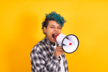 girl with megaphone isolated on color background