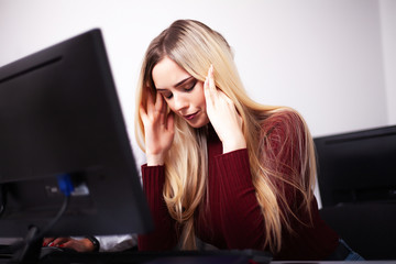 Beautiful Businesswoman suffering pain on her office