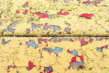 Colorful peeling paint on a metal surface, texture