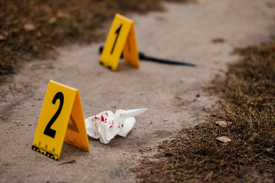 Crime scene with yellow signs.