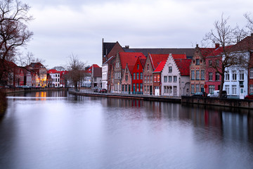 Naklejka premium Buildings in Bruges (Belgium) reflecting in the Water