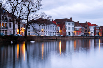 Fototapeta na wymiar Buildings in Bruges (Belgium) reflecting in the Water