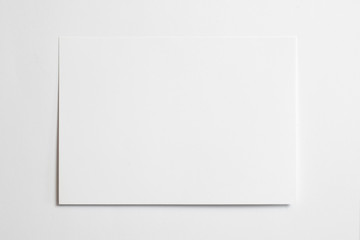 Blank horizontal photo frame 10 x 15 size with soft shadows tape isolated on white paper background as template for graphic designers presentations, portfolios etc.