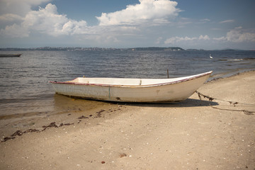 Small wooden fishing boat on the coast