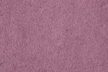 Vintage paper texture cardboard close-up, purple color. Recyclable material, has small inclusions of cellulose.