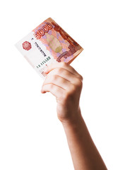 Five thousand Russian rubles in the hands of a child, isolated on a white background. Concept on the topic of money management in childhood