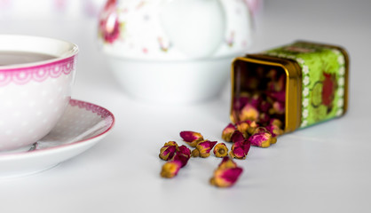 A cup of tea with dried roses