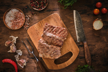Grilled beef steak with spices. Top view