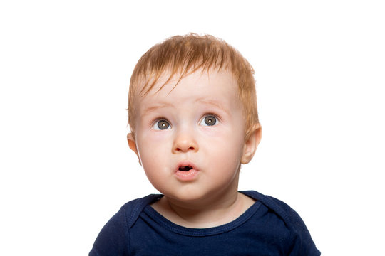 portrait of a surprised child with wide eyes from unexpected emotions, eyes looking up, Toddler isolated on a white background.