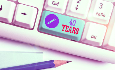 Writing note showing 40 Years. Business concept for Remembering or honoring special day for being...