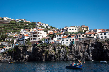 Fototapeta na wymiar Camara de Lobos is a picturesque fishing village with high cliffs near the city of Funchal Madeira . Winston Churchill loved to paint this village