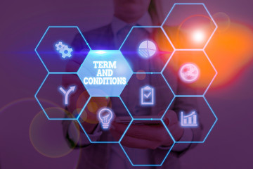 Writing note showing Term And Conditions. Business concept for Policies and Rules where one must...