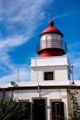 Fototapeta na wymiar Lighthouse at Ponto de Pargo on the southern Coast of Madeira